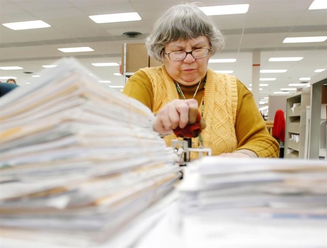Kathleen Malone works on tax returns at the Cincinnati 