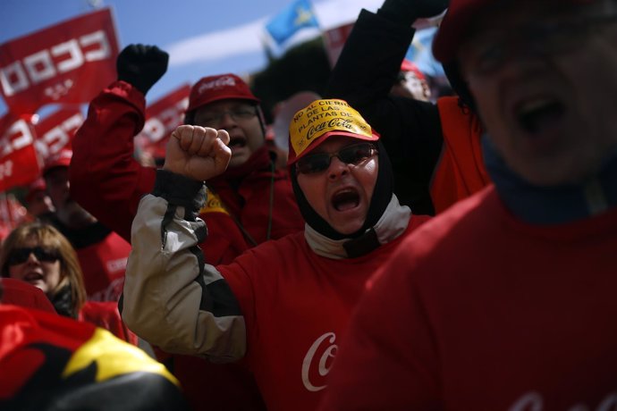 Demonstrators shout slogans during a protest against the closure of four Coca-Co