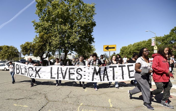 About fifty demonstrators march to protest police violence against minorities in