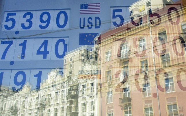 Currency exchange rates are reflected in a window in Kiev