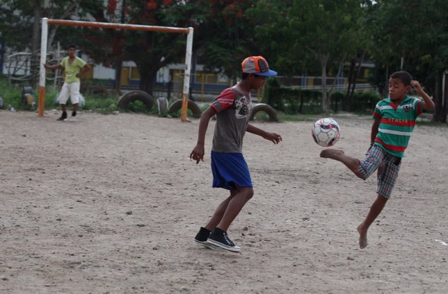 Boys play soccer in Fundacion