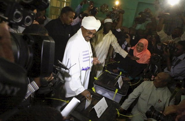 Sudan's President al-Bashir casts his ballot during elections in the capital Kha