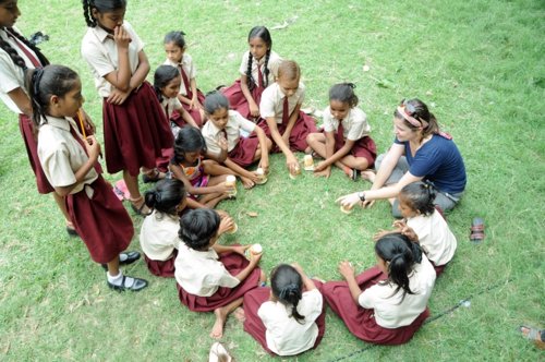 Pradeep and Laura Blank playing with the girls from the Snehadeep Street Childre