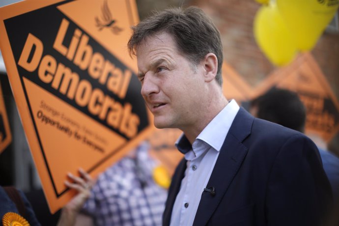 Britain's Liberal Democrat leader Nick Clegg reacts as he campaigns with local c