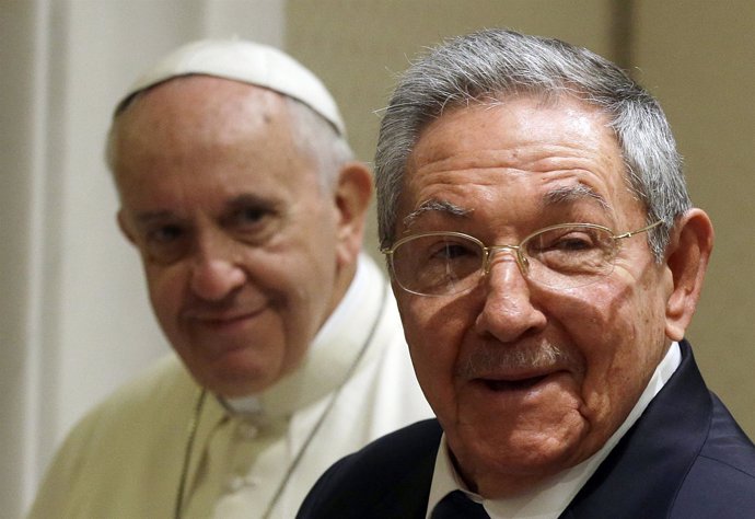 Cuban President Raul Castro smiles as he meets Pope Francis during a private aud