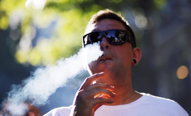 Man smokes marijuana during a demonstration in support of the legalization of ma