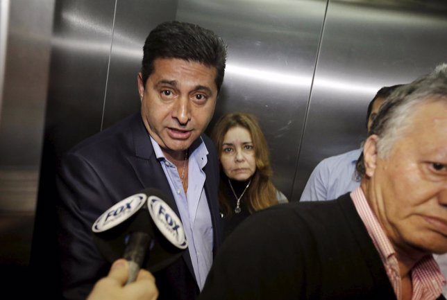 Boca Juniors president Daniel Angelici speaks in an elevator after a meeting at 