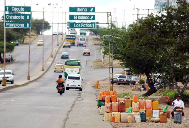 A gasoline smuggler waits for customers in the colombian side at the border betw