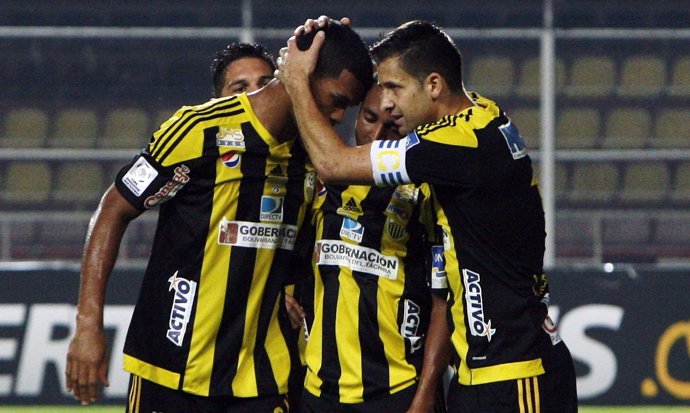 Gonzalez celebrates with his teammates after scoring in San Cristobal