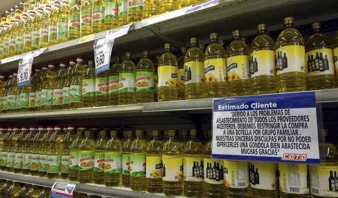 Bottles of oil are seen on a supermarket shelf in Buenos Aires