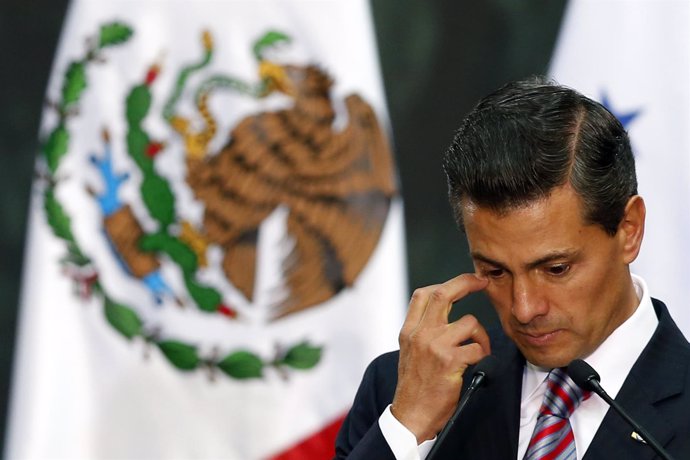 Mexico's President Enrique Pena Nieto gestures during the signature of an agreem