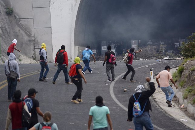 Students of Ayotzinapa Teacher Training College Raul Isidro Burgos clash with ri