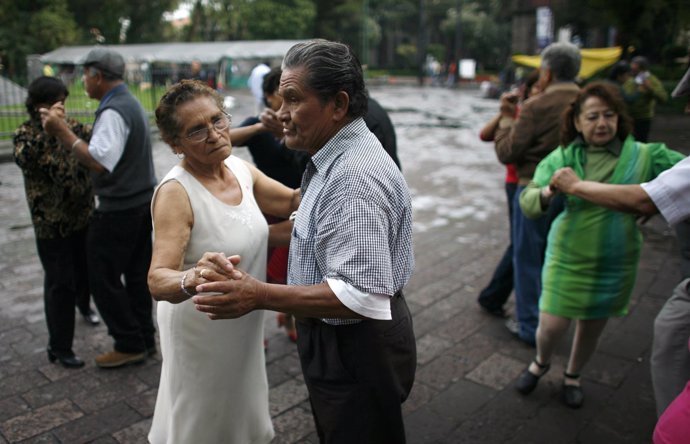 Mexican people dance Danzon, a typical Latin-American rhythm, at the park in Mex