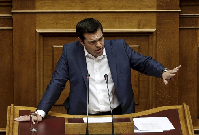 Greek PM Alexis Tsipras delivers a speech during a parliamentary session to brie