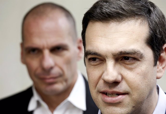 Tsipras makes statements to the media as Finance Minister Varoufakis.