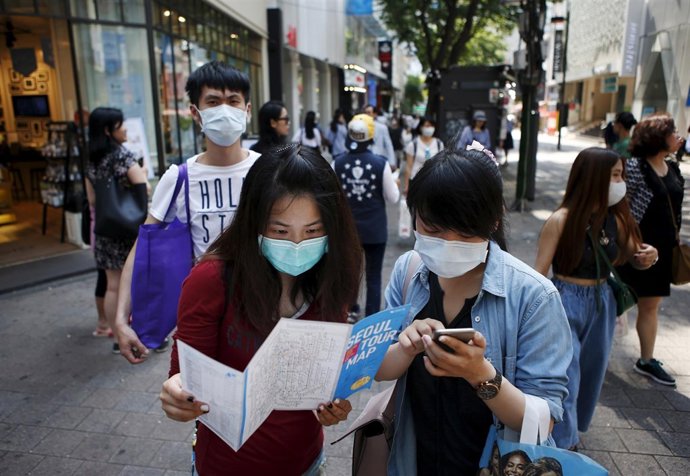 Tourists wearing masks to prevent contracting Middle East Respiratory Syndrome (