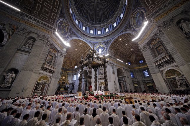 Pope Francis stands as he leads the Chrism mass in Saint Peter's basilica at the