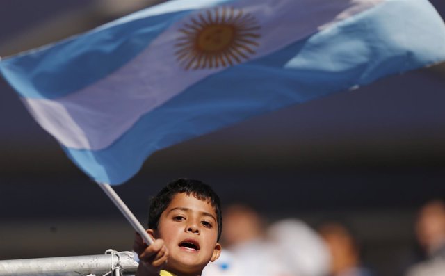 A young fan waves an Argentina flag ahead of the country's first round Copa Amer