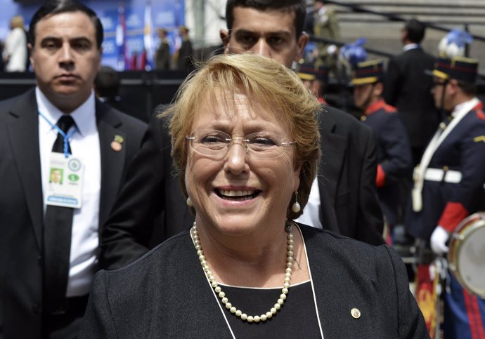 Michelle Bachelet walks after attending an event where Tabare Vazquez received t