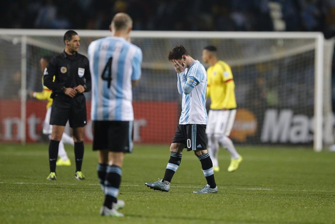 Argentina's Messi reacts as teammate Zabaleta looks on before the start of the s