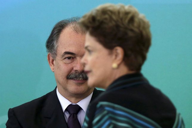 Brazil's Chief of Staff Aloizio Mercadante reacts next to President Dilma Rousse