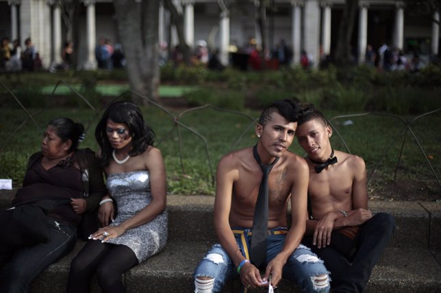 Revellers rest after participating in the gay pride parade in Guatemala City