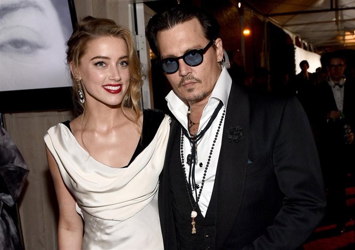 LOS ANGELES, CA - JANUARY 10: Actors Amber Heard (L) and Johnny Depp attend the 