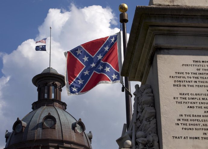 The U.S. Flag and South Carolina state flag flies at half staff to honor the nin