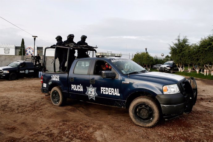 Police keep watch outside the Altiplano Federal Penitentiary, after drug lord Jo