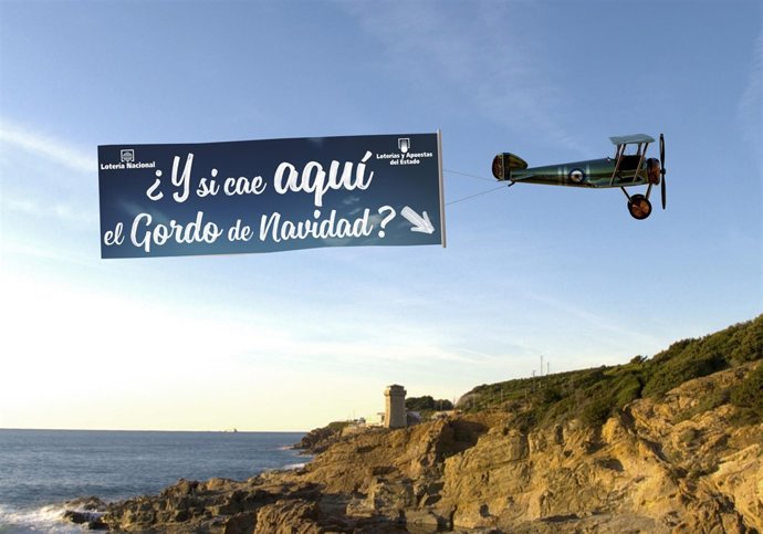 Biplane pulling a blank banner on the beach; Shutterstock ID 68749087