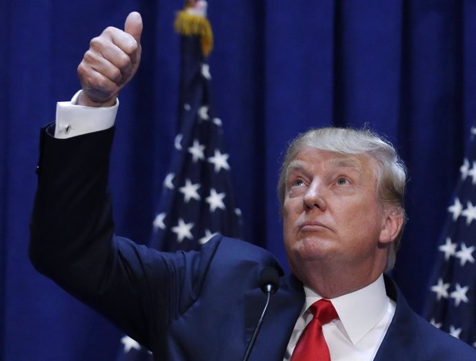 U.S. Republican presidential candidate Trump acknowledges supporters while forma