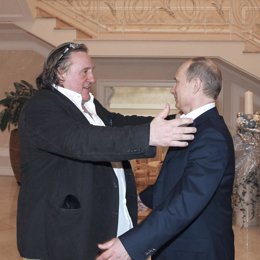 Russian President Vladimir Putin greets French actor Gerard Depardieu during the