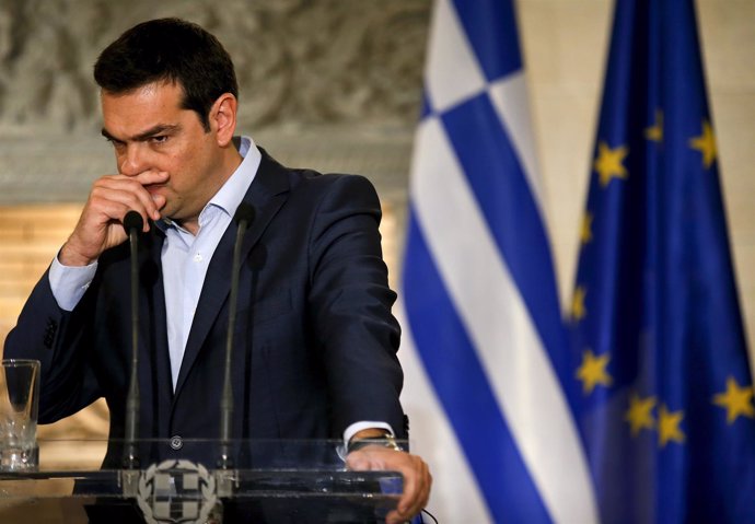 Greek PM Tsipras gestures during a news conference in Athens