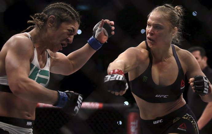 Rousey of U.S fights with Correia of Brazil during their UFC match