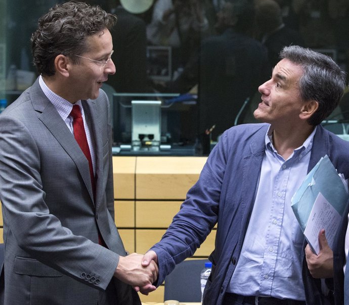 Newly appointed Greek Finance Minister Tsakalotos is welcomed by Eurogroup Presi