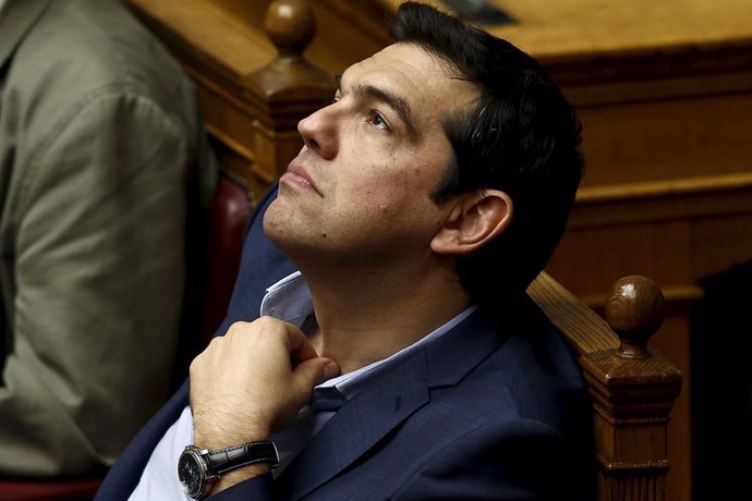 Greek PM Tsipras looks on during a parliamentary session in Athens