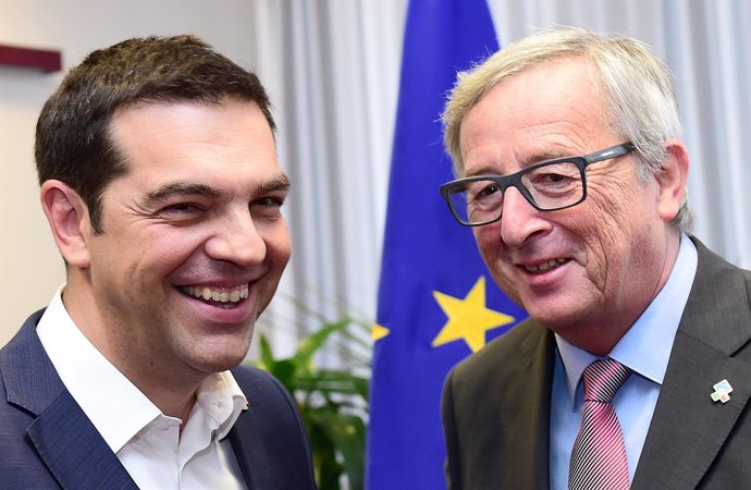 Greek PM Tsipras poses with EU Commission President Juncker ahead of a meeting i