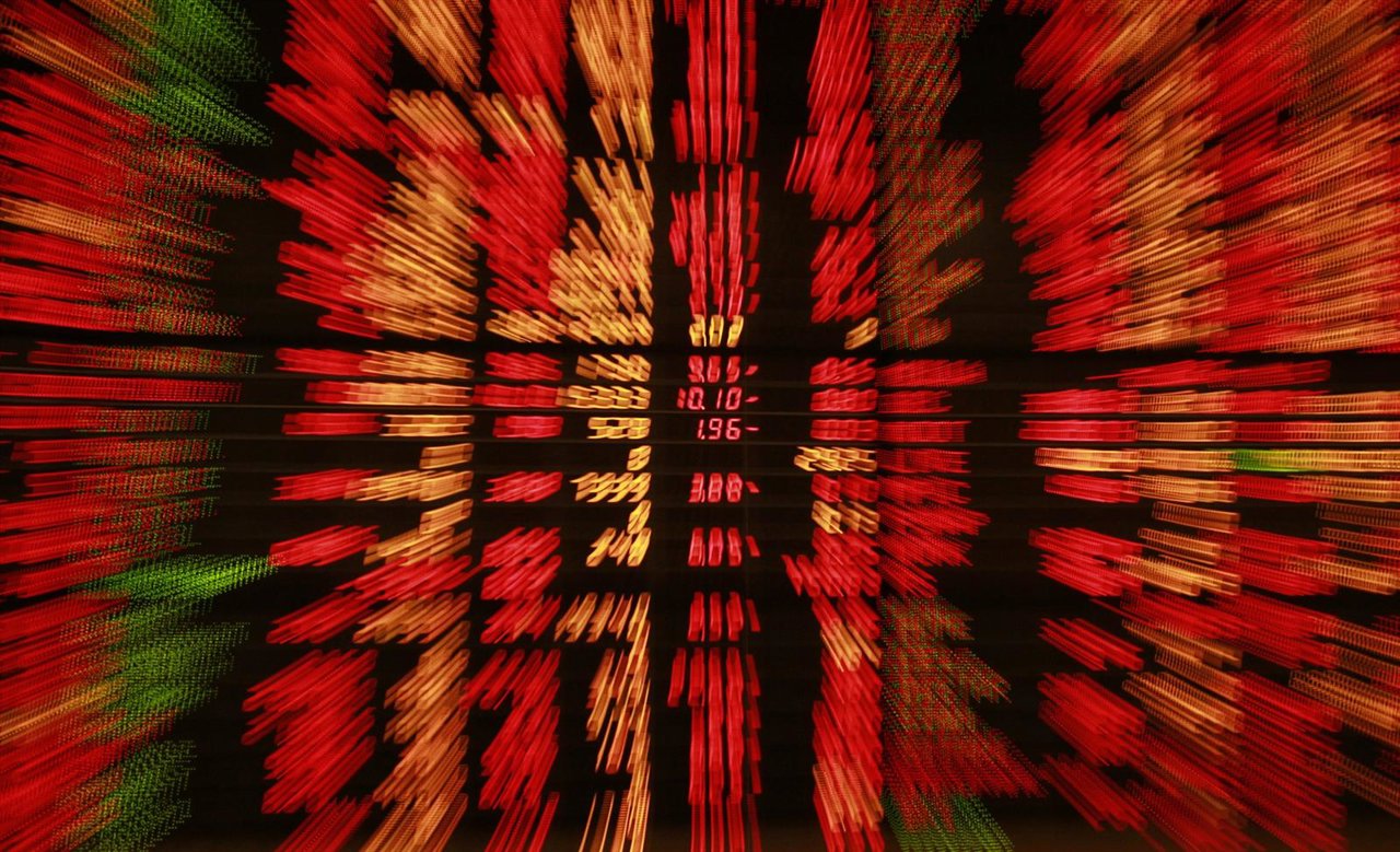 An electronic board displays live market data at a stock broker's office in cent