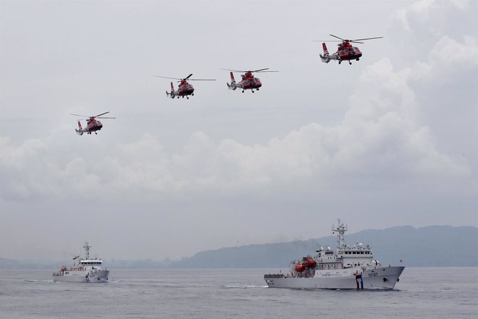 Taiwan Coast Guard patrol ships and helicopters from National Airborne Service C