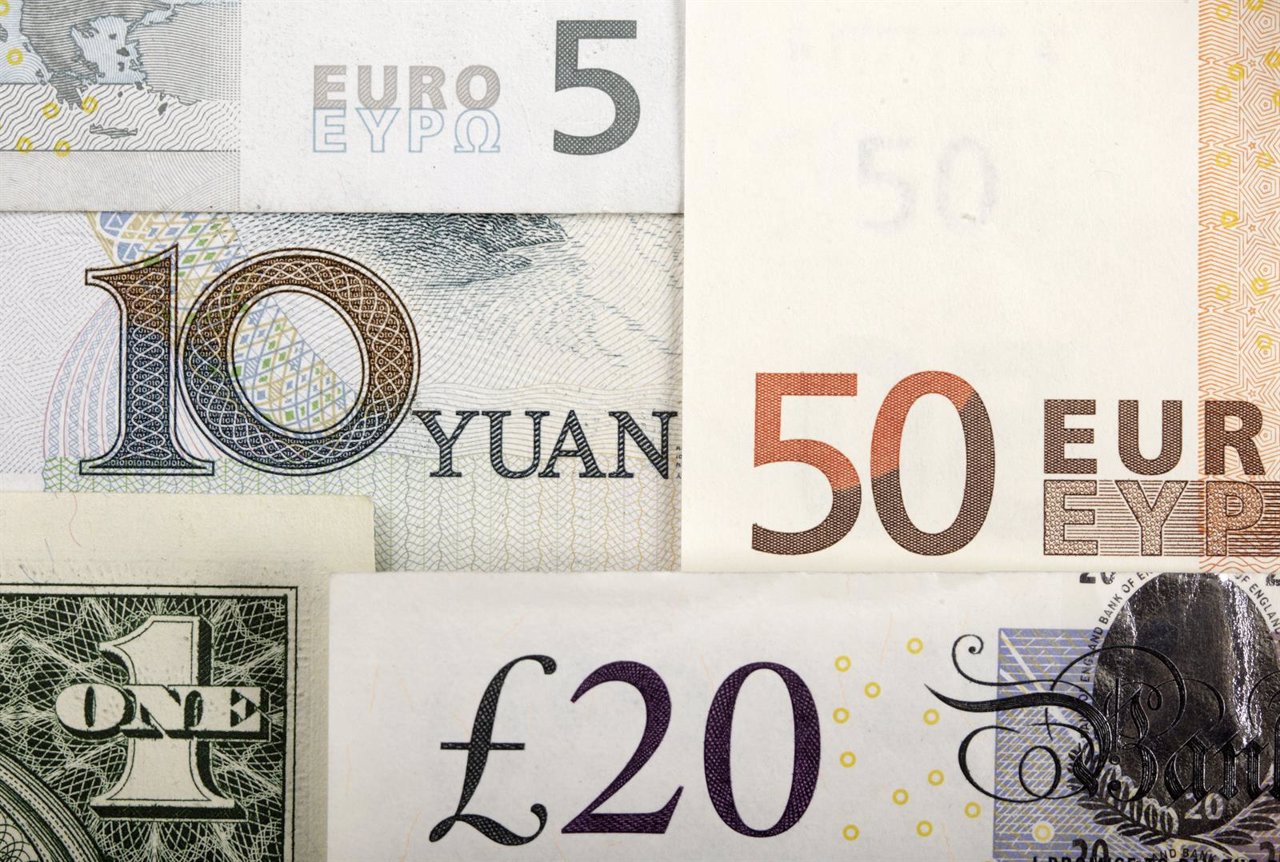 Arrangement of various world currencies including Chinese Yuan, US Dollar, Euro,