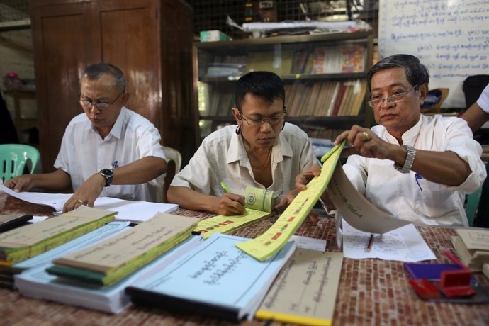 Officials prepare a polling station ahead of Myanmar's general elections, in Yan