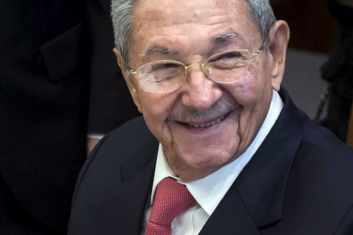 Cuba's President Raul Castro signs a guest book in the United Nations Secretary 