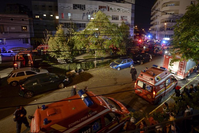 Emergency services work outside a nightclub in Bucharest