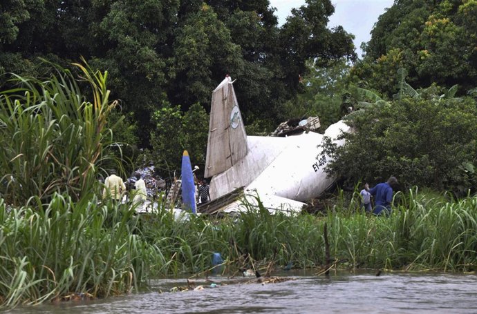 Officials investigate the wreckage of a cargo airplane that crashed after take-o