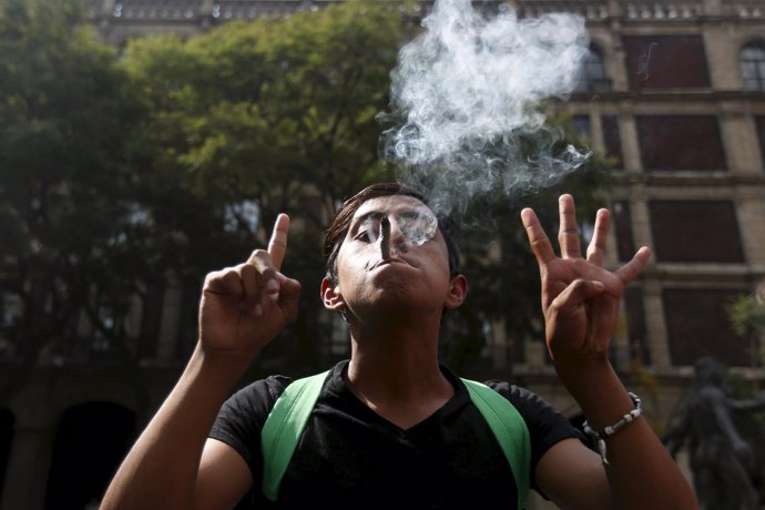 A man gestures during a demonstration in support of the legalization of marijuan