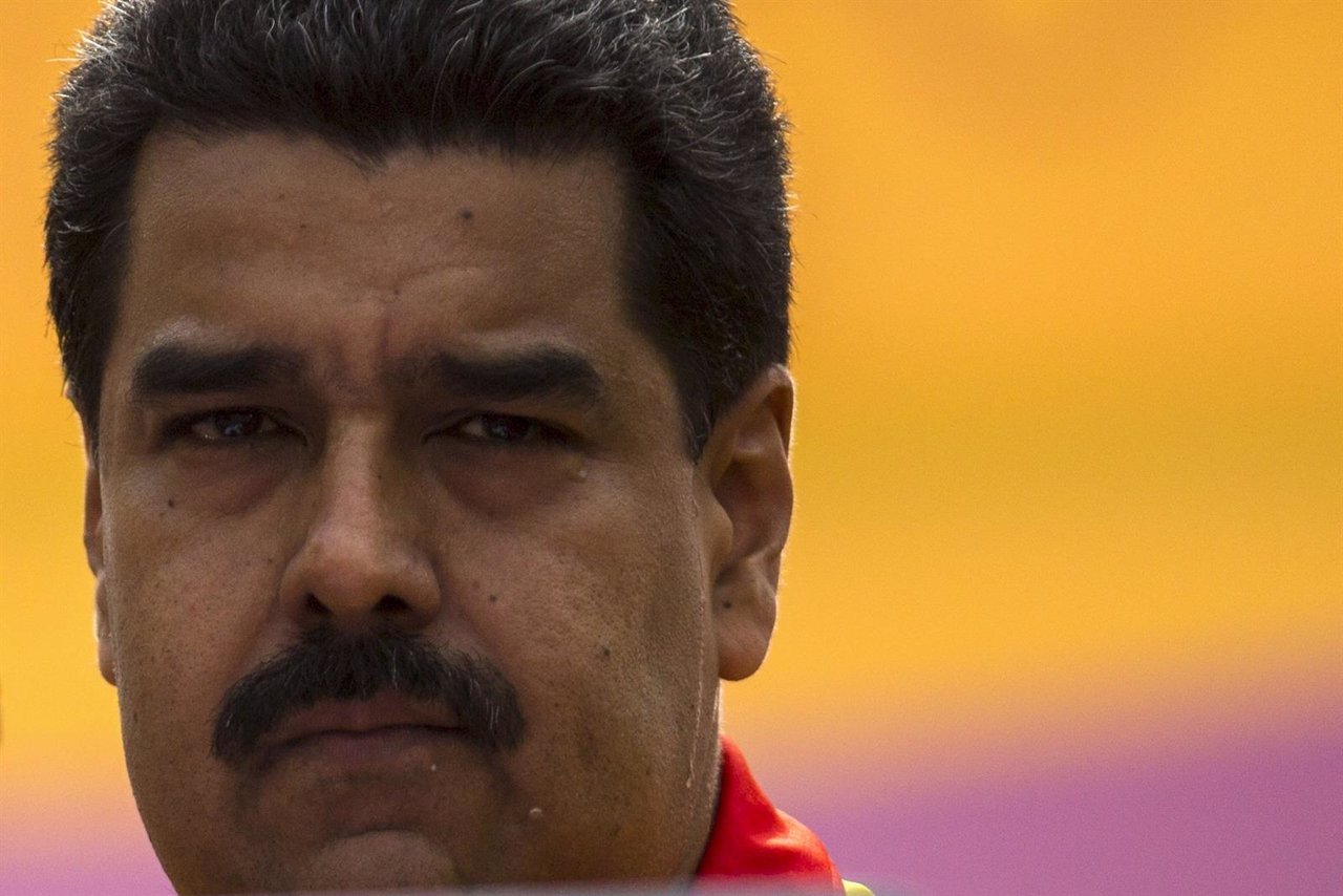 Venezuela's President Nicolas Maduro looks on during a rally outside Miraflores 