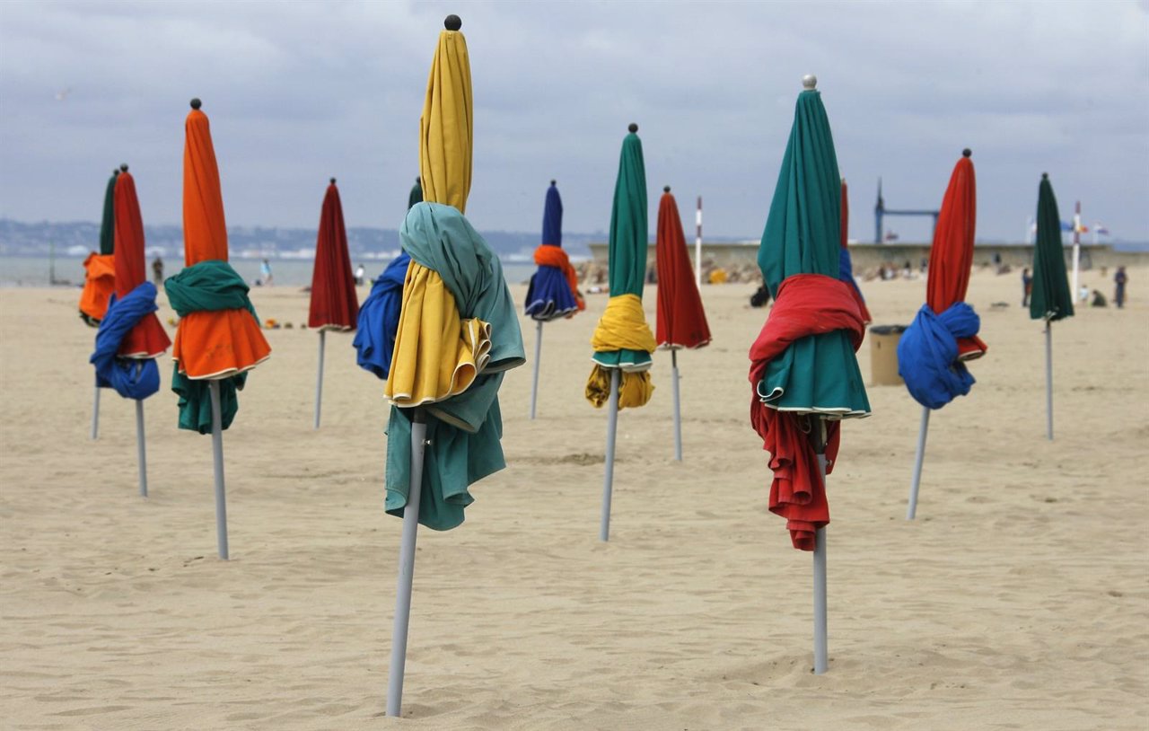 Beach umbrellas are seen along a beach, on the eve of the opening of the America