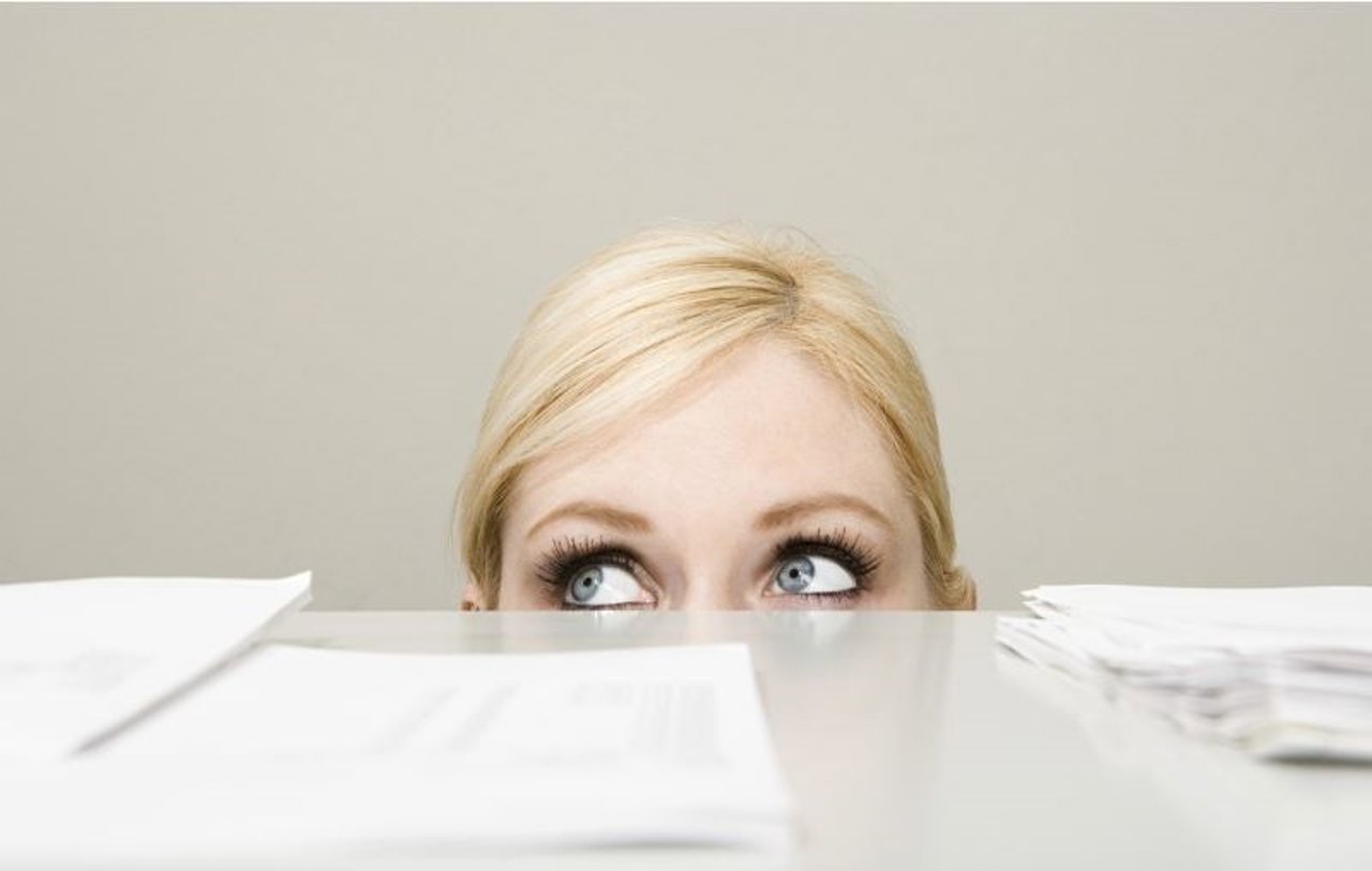 Woman behind filing cabinet