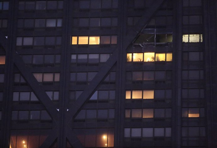 Windows are seen missing from the 50th floor of the John Hancock Center after a 