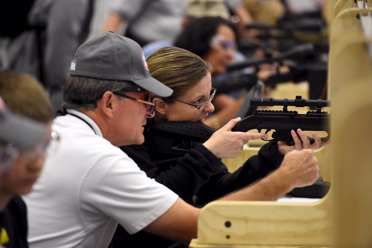 Attendees visit the air gun range during the NRA's annual meeting in Nashville